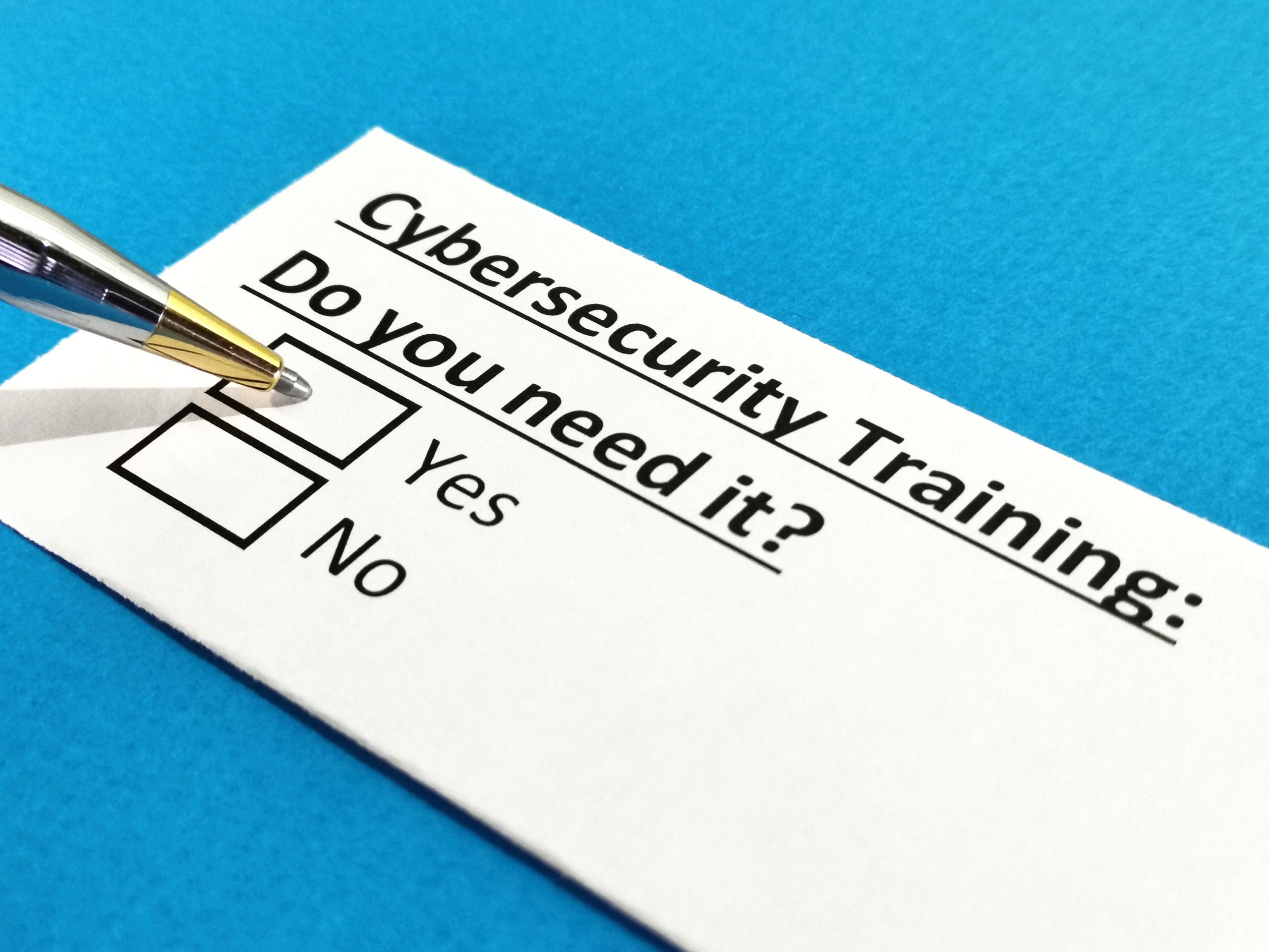 A piece of paper that says, "Cybersecurity training: Do you need it?" with two check boxes that say "Yes" and "No."